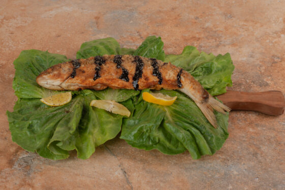 TROUT WITH HERBS AND WHITE WINE 2 Fresh rosemary, garlic, and dry white wine create a flavorful and aromatic baked trout.