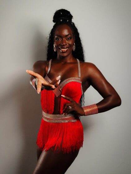 Her journalism background shapes her view of samba as cultural storytelling.
