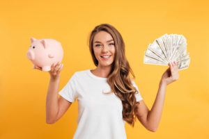 portrait cheery young girl holding piggy bank 171337 11448