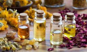 bottles of essential oil with dried rose petals chamomile calendula picture id900990692 760x450 1