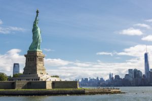 statue of liberty and the new york city skyline usa