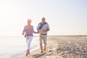 vital seniors on the beach senior couple in the beach retirement and summer vacation concept