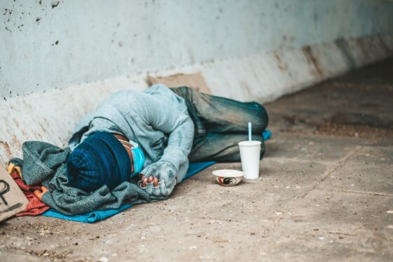 beggars lying side street with dirty clothes 1150 22921